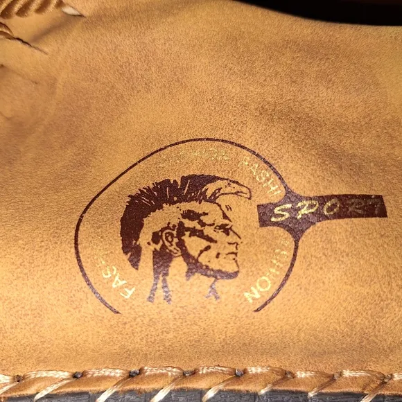 A pair of Fashion Sport moccasin booties with a furry insole.In a men's US 12.