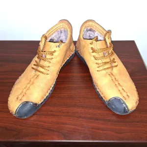A pair of Fashion Sport moccasin booties with a furry insole.In a men's US 12.
