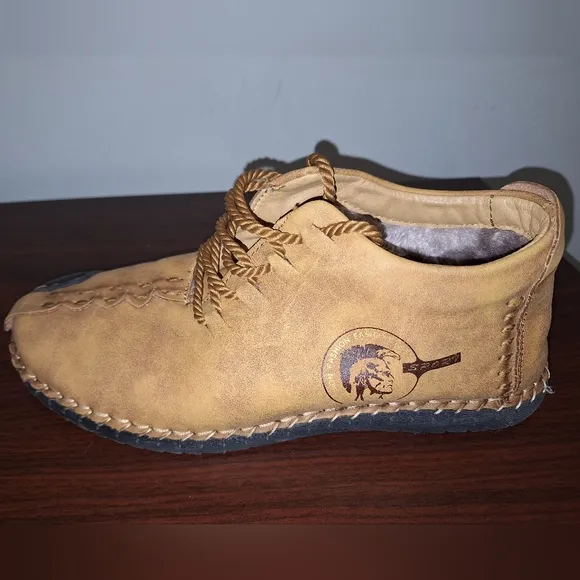 A pair of Fashion Sport moccasin booties with a furry insole.In a men's US 12.