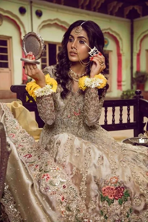 Beutifull bridal lahnga in red and gold with heavy dabka nagh pearls threds and crystals work Model#B 1111